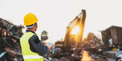 an environmental manager onsite collecting information about their organization's environmental impact using an environmental aspects and impacts register on tablet