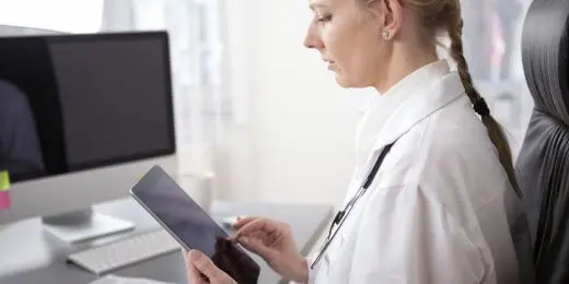 medical professional using an eu mdr checklist on their tablet