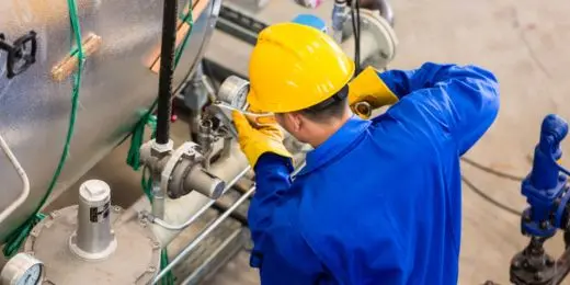 worker doing maintenance work on an equipment