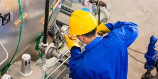 worker doing maintenance work in a machine