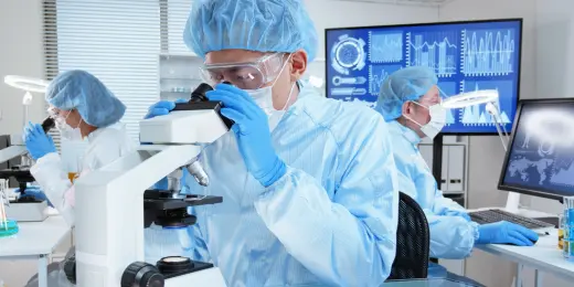 A scientist practicing lab safety