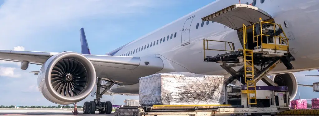 an air freight software being used to check the condition of freights being loaded to an airplane