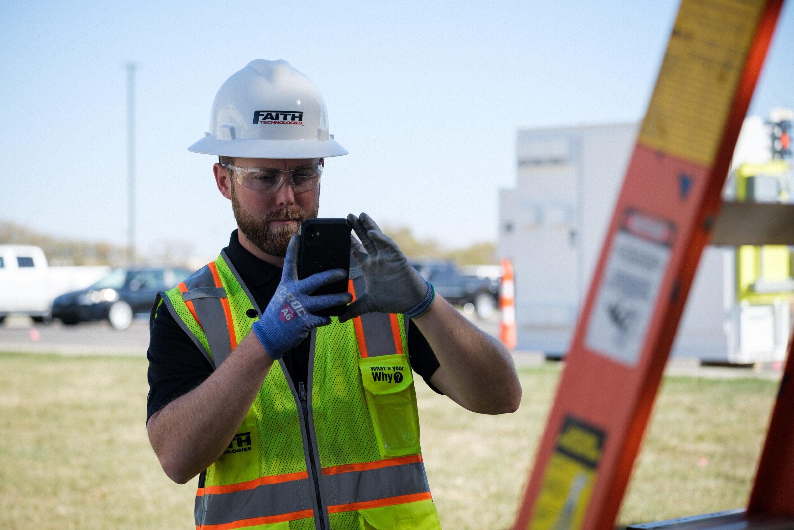 A safety manager using a job safety analysis software before the start of a process