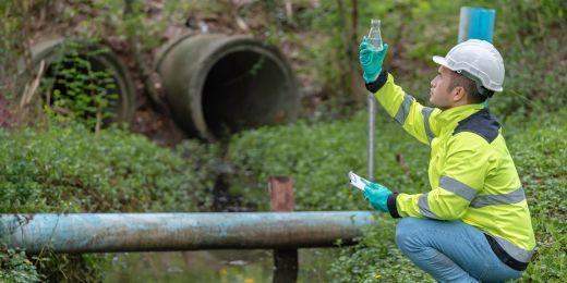 an environmental professional testing water quality for water quality management purposes