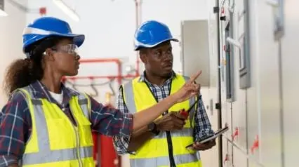 safety officers inspect electrical systems for fire hazards