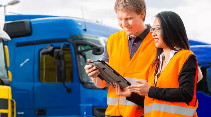 Employees using a transport and logistics checklist