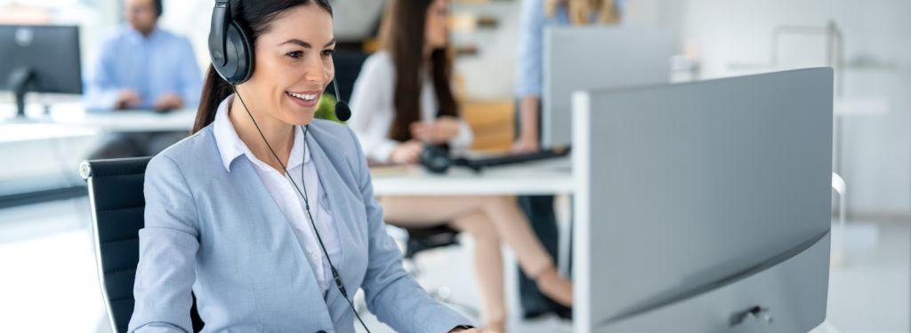 a customer service representative going through customer feedback using customer satisfaction software on a desktop